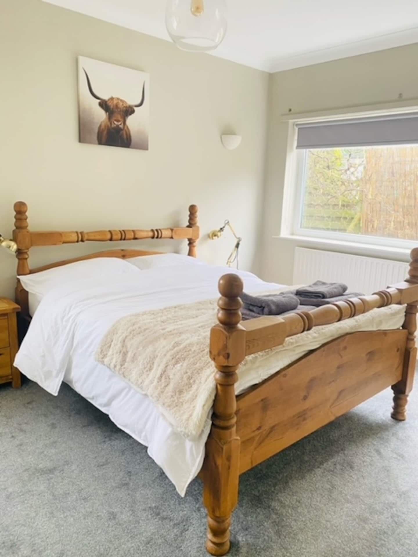 Double bedroom with comfortable bed and countryside feel throughout